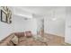 Spacious living room featuring a vintage sofa and decorative accents at 35 E Secretariat Dr, Tempe, AZ 85284