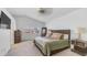 Bright main bedroom featuring neutral walls, ceiling fan, and large bed at 35 E Secretariat Dr, Tempe, AZ 85284