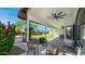 Inviting covered patio offering a relaxing outdoor space with ceiling fans and backyard access at 35 E Secretariat Dr, Tempe, AZ 85284