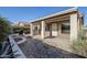 Covered back patio with lush landscaping, perfect for enjoying the outdoors in comfort at 3649 E Hazeltine Way, Chandler, AZ 85249