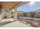 Relaxing covered patio with stone accents, perfect for outdoor dining and entertaining at 3649 E Hazeltine Way, Chandler, AZ 85249