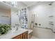 This bathroom showcases vanity storage, grab bars for assistance, and a shower with a detachable shower head at 3649 E Hazeltine Way, Chandler, AZ 85249
