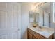 This bathroom has a white marble countertop, a vanity, decorative mirrors, and ample natural light at 3649 E Hazeltine Way, Chandler, AZ 85249