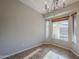 Bright dining area with chandelier and three windows at 3649 E Hazeltine Way, Chandler, AZ 85249