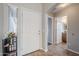 Bright foyer featuring tile flooring, neutral paint, and views into the hallway and bathroom at 3649 E Hazeltine Way, Chandler, AZ 85249