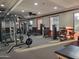 Well-lit fitness center equipped with weight machines and exercise equipment supports a healthy and active lifestyle at 3649 E Hazeltine Way, Chandler, AZ 85249