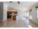 Open-concept kitchen with stainless steel appliances and adjacent dining area with chandelier at 3649 E Hazeltine Way, Chandler, AZ 85249