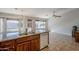 Kitchen island featuring granite countertop, stainless steel sink and dishwasher, and backyard views at 3649 E Hazeltine Way, Chandler, AZ 85249