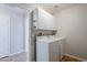 This laundry room features a washer and dryer, along with white cabinets for storage at 3649 E Hazeltine Way, Chandler, AZ 85249