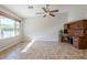Living room featuring tile floors, a ceiling fan, and natural light from a large window at 3649 E Hazeltine Way, Chandler, AZ 85249