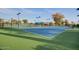 Well-maintained tennis courts with lighting and covered seating areas offer an active outdoor lifestyle at 3649 E Hazeltine Way, Chandler, AZ 85249