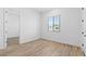 Empty bedroom showcasing tiled floors and a bright window at 37727 W Padilla St, Maricopa, AZ 85138