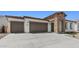 This home boasts a spacious three-car garage, enhancing curb appeal and offering ample parking at 37727 W Padilla St, Maricopa, AZ 85138