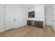 Hallway with a kitchenette and storage cabinets at 37727 W Padilla St, Maricopa, AZ 85138