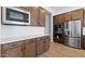 Well-equipped kitchen featuring stainless steel appliances and stylish cabinetry at 37727 W Padilla St, Maricopa, AZ 85138