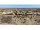 A collection of luxury homes are perched high on the desert hillside overlooking the stunning mountain views in the distance at 402 E Windmere Dr, Phoenix, AZ 85048