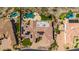 An aerial perspective highlights lush landscaping, private pools, and solar panels on the tiled roof of the luxury desert homes at 402 E Windmere Dr, Phoenix, AZ 85048