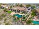 Impressive aerial view of resort-style backyard featuring a private pool, lush greenery, and stunning landscaping at 402 E Windmere Dr, Phoenix, AZ 85048