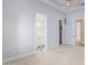 Carpeted bedroom showcasing ensuite bathroom with modern fixtures and a generously sized walk-in closet at 402 E Windmere Dr, Phoenix, AZ 85048