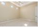 This spacious carpeted bedroom features a tray ceiling with recessed lights and natural light at 402 E Windmere Dr, Phoenix, AZ 85048