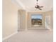Spacious carpeted bedroom boasts a ceiling fan, recessed lighting, and an incredible mountain view at 402 E Windmere Dr, Phoenix, AZ 85048