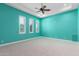 Turquoise bedroom with recessed lighting, ceiling fan, white trim, and bright carpet at 402 E Windmere Dr, Phoenix, AZ 85048