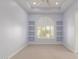 This carpeted bedroom features custom tray ceiling, recessed lighting, and built-in shelving at 402 E Windmere Dr, Phoenix, AZ 85048