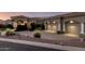 Stunning home exterior featuring a manicured landscape, a tiled roof, and a two-car garage at 402 E Windmere Dr, Phoenix, AZ 85048