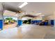 Spacious garage with bright blue trim, a concrete floor, and garage door to the driveway at 402 E Windmere Dr, Phoenix, AZ 85048