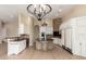 Spacious kitchen featuring a central island, modern appliances, and decorative tile work at 402 E Windmere Dr, Phoenix, AZ 85048