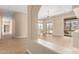 Open-concept living room featuring hardwood floors and a seamless flow to outdoor patio at 402 E Windmere Dr, Phoenix, AZ 85048