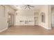 Bright, neutral living room featuring built-in shelving and a ceiling fan at 402 E Windmere Dr, Phoenix, AZ 85048