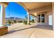 Extensive patio showcasing its stone pillars and outdoor living space with a pool and desert views at 402 E Windmere Dr, Phoenix, AZ 85048