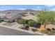 Aerial view of a single-story house in a neighborhood, showcasing the home's roof and desert landscaping at 4125 W Gary Way, Laveen, AZ 85339