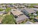 Aerial view of a single-story home's backyard with turf, gravel, and patio at 4125 W Gary Way, Laveen, AZ 85339