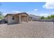 Spacious backyard with covered patio and low-maintenance gravel landscaping at 4125 W Gary Way, Laveen, AZ 85339