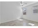 Bedroom with tile flooring, a ceiling fan, and two windows at 4125 W Gary Way, Laveen, AZ 85339