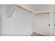 Walk-in closet featuring a white shelf and wooden hanging bar at 4125 W Gary Way, Laveen, AZ 85339