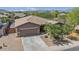 Charming single-story home featuring a neutral color palette, desert landscaping, and a two car garage at 4125 W Gary Way, Laveen, AZ 85339
