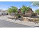Charming single-story home featuring a neutral color palette, desert landscaping, and a two car garage at 4125 W Gary Way, Laveen, AZ 85339