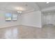 Inviting living room with tile floors, modern lighting, and a view of the hallway for easy access to other rooms at 4125 W Gary Way, Laveen, AZ 85339