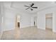 This main bedroom features tile floors, natural light, and ceiling fan, with ensuite and walk-in closet at 4125 W Gary Way, Laveen, AZ 85339