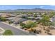 Scenic aerial view of a residential neighborhood with mountain views, desert landscaping, and charming single-Gathering homes at 4125 W Gary Way, Laveen, AZ 85339