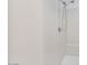 All white shower with a hand held shower head and built in bench at 4125 W Gary Way, Laveen, AZ 85339