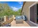 Relaxing balcony with comfortable seating and views of the lush backyard at 4976 E Thunderbird Dr, Chandler, AZ 85249