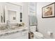 Elegant bathroom with granite countertop, vessel sink, and shuttered window at 4976 E Thunderbird Dr, Chandler, AZ 85249