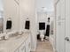 A well-maintained bathroom featuring a vanity, toilet, shower and practical storage cabinets at 4976 E Thunderbird Dr, Chandler, AZ 85249
