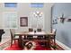 Stylish dining area boasts modern lighting, shuttered windows, and adjacent piano room at 4976 E Thunderbird Dr, Chandler, AZ 85249