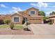 Charming two-story home with well-manicured lawn, desert landscaping, and an inviting facade at 4976 E Thunderbird Dr, Chandler, AZ 85249