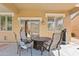 Outdoor patio area with dining table and chairs perfect for entertaining at 4976 E Thunderbird Dr, Chandler, AZ 85249